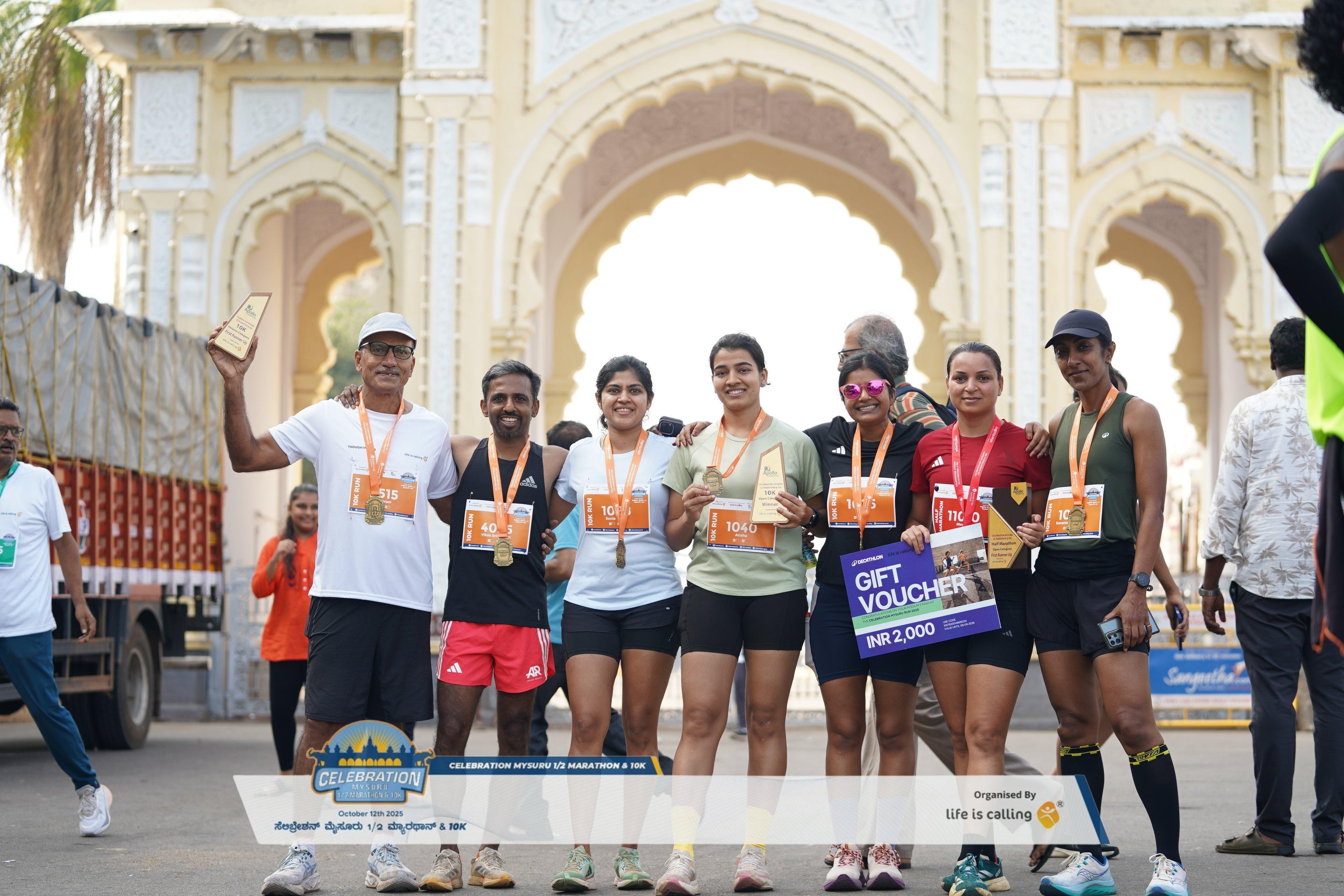 Runpundit team podium at the Mysore Celebration Marathon 2024, Mysore Palace Arch