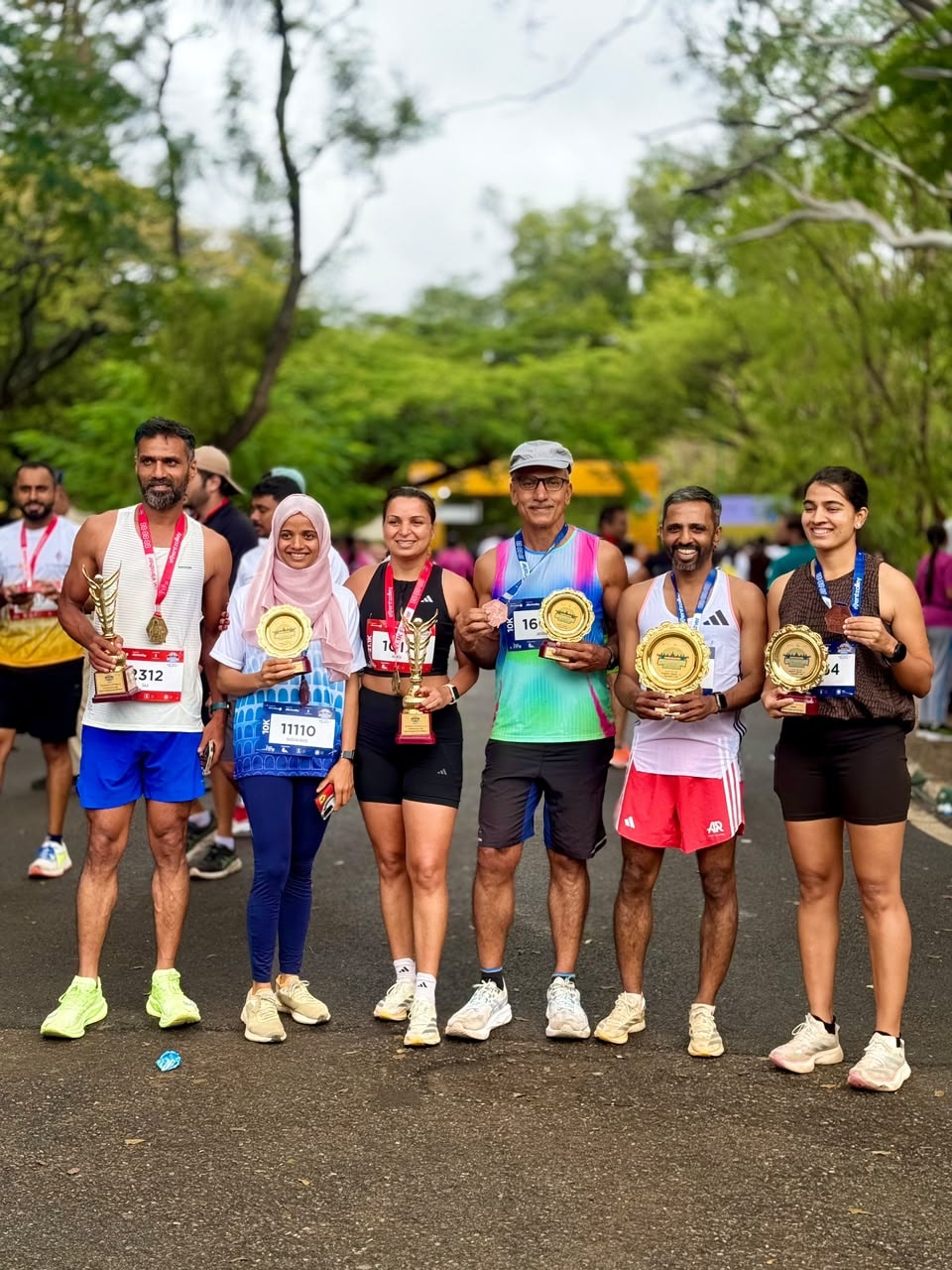 Runpundit squad with six trophies at the Celebration Mysuru Half Marathon & 10K 2026
