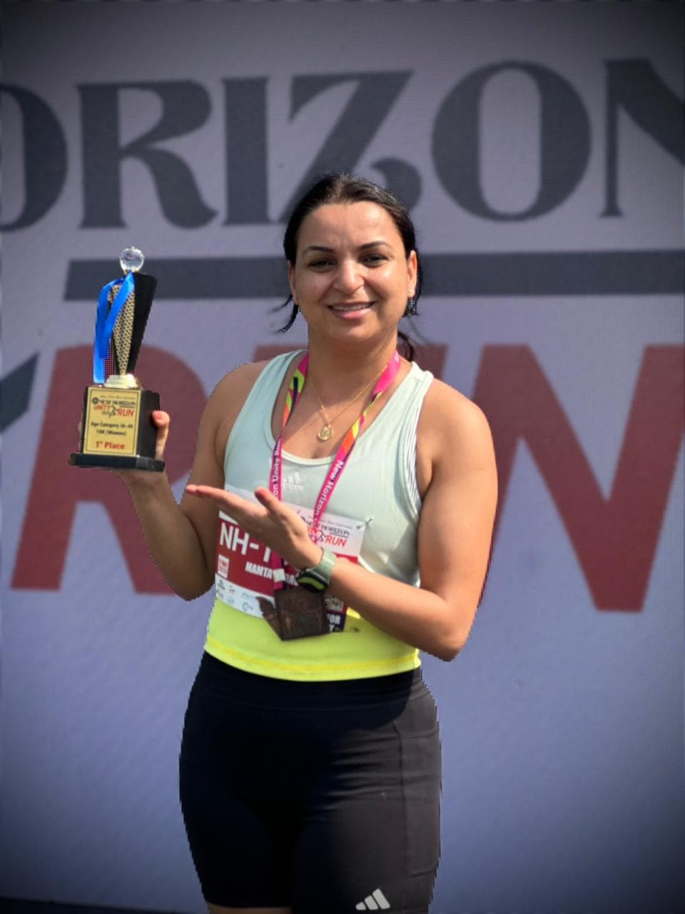 Coach Mamta Yadav with her 1st place trophy at New Horizon Silver Jubilee Run 2026