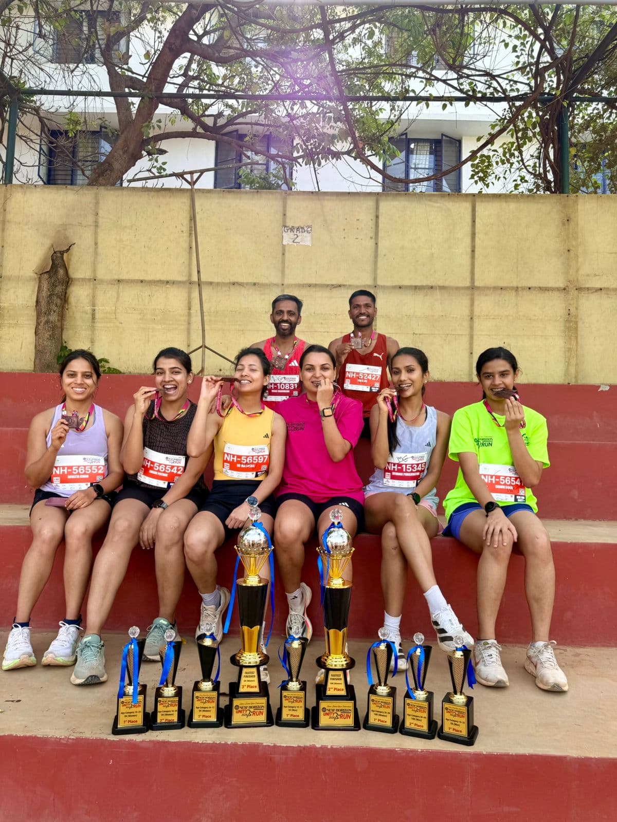 Runpundit team with multiple trophies at New Horizon Silver Jubilee Run 2026