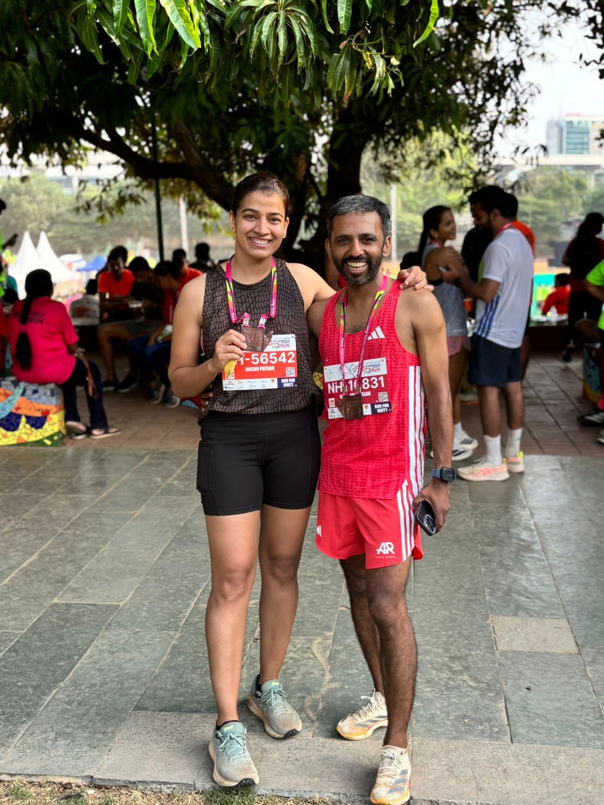Coach Vikas Srinivasan with athlete Anshu Pathak after racing the New Horizon Silver Jubilee Run 2026