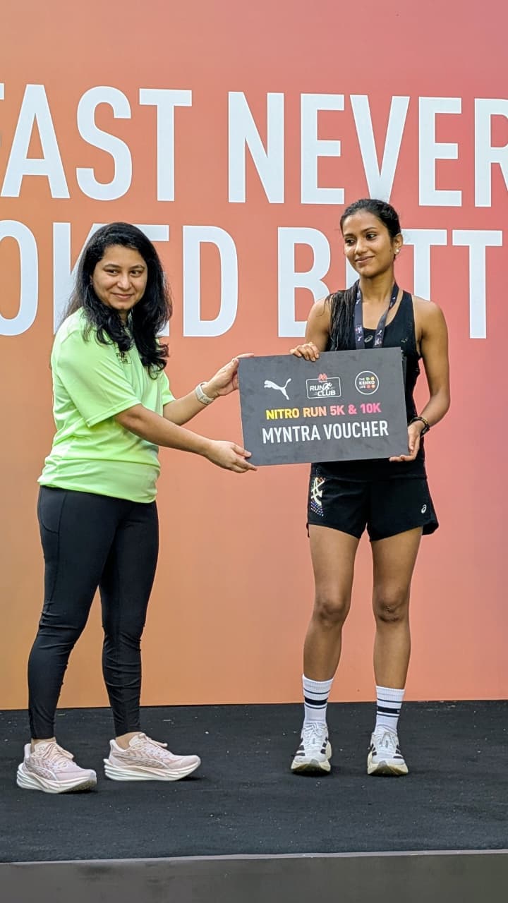Devangi Purkayastha receiving the Puma Nitro Run 10K Overall Winner prize